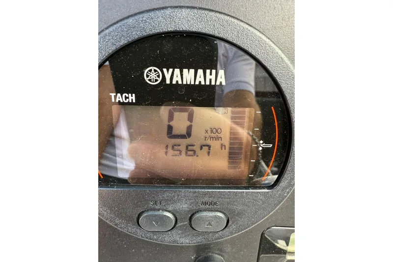 Slide: The Image of Yamaha tachometer displaying 156.7 hours on a 2021 Robalo R227 Dual Console boat. - 23