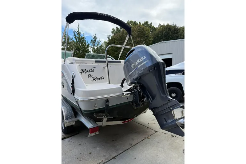 Slide: The Image of 2021 Robalo R227 Dual Console boat with Yamaha outboard motor on trailer. - 3