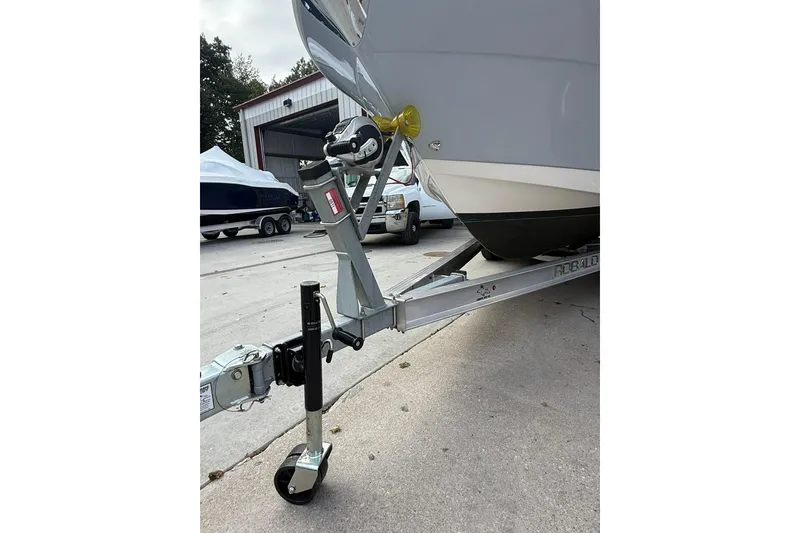 Slide: The Image of 2021 Robalo R227 Dual Console boat on trailer in storage facility. - 4