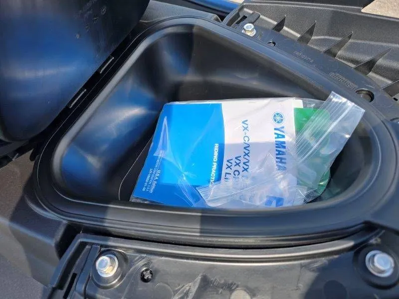 Slide: The Image of Yamaha Waverunner VX Deluxe 2026 storage compartment with manual. - 21