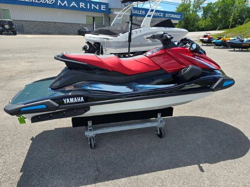 Slide: The Image of 2026 Yamaha Waverunner VX Deluxe with Audio, red and black, on parking lot. - 26