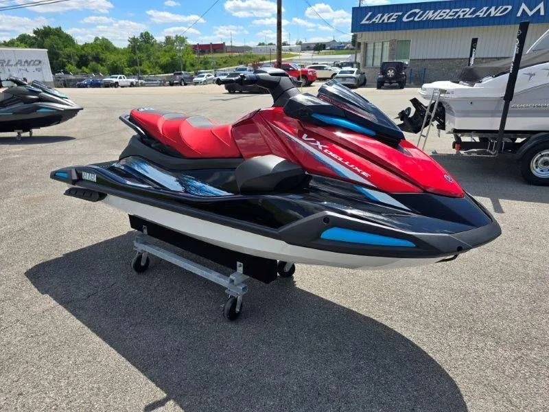 Slide: The Image of 2026 Yamaha Waverunner VX Deluxe with Audio, red and black, on parking lot. - 29
