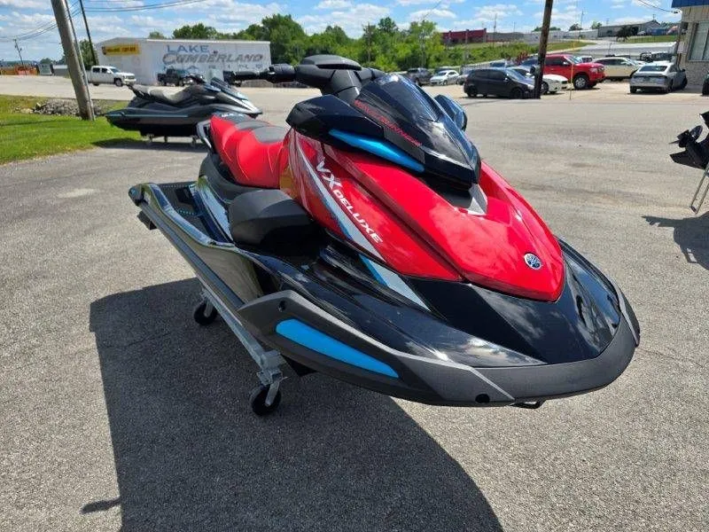 Slide: The Image of 2026 Yamaha Waverunner VX Deluxe with Audio, red and black, on parking lot. - 33