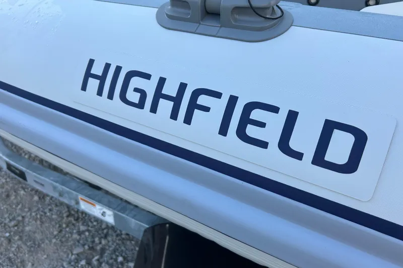 Slide: The Image of Highfield Classic 310 FCT 2024 model, close-up of boat branding on hull. - 4