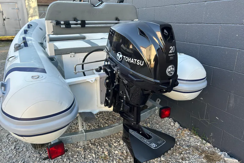 Slide: The Image of 2024 Highfield Classic 310 FCT boat with Tohatsu 20 HP outboard motor. - 6