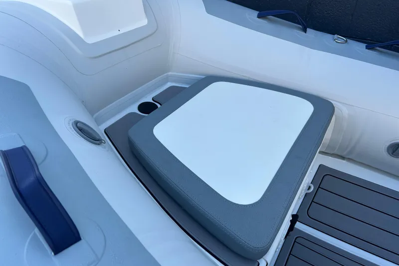 Slide: The Image of 2024 Highfield Classic 310 FCT boat interior with cushioned seating and storage. - 7