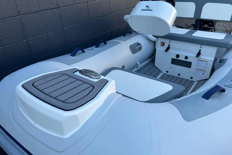 Slide: The Image of 2024 Highfield Classic 310 FCT inflatable boat interior with seating and controls. - 8