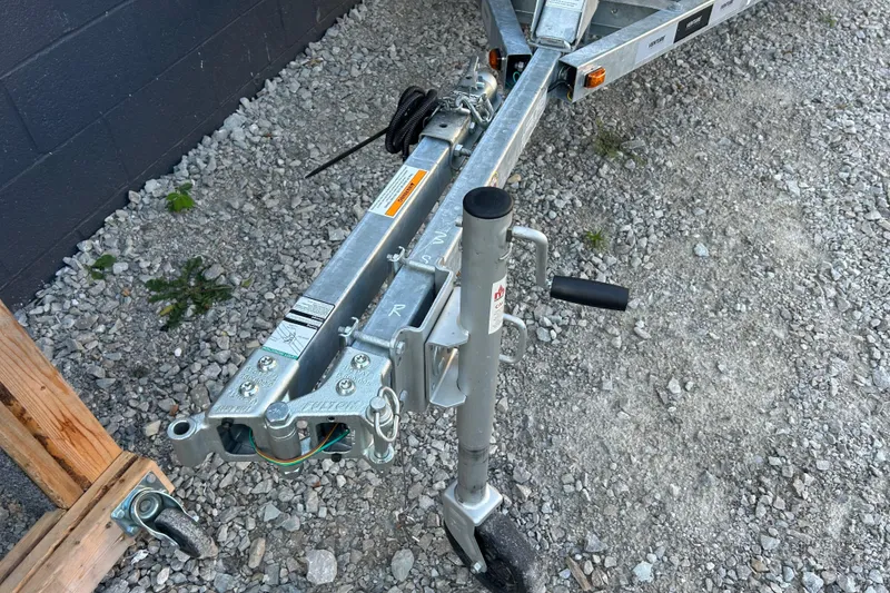 Slide: The Image of Trailer hitch and jack stand on gravel for 2024 Highfield Classic 310 FCT boat. - 9