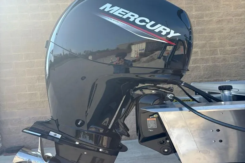 Slide: The Image of Mercury outboard motor on 2026 Sun Tracker SportFish 22 DLX boat, side view. - 7