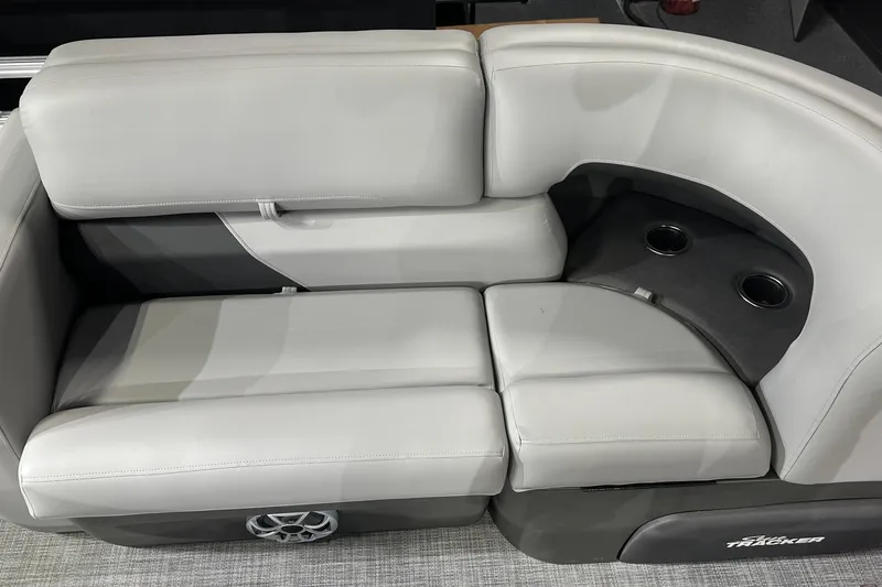 Slide: The Image of 2026 Sun Tracker SportFish 22 DLX boat seating with cup holders and speaker. - 17