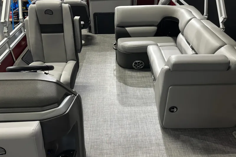 Slide: The Image of 2026 Sun Tracker SportFish 22 DLX interior with gray seating and modern design. - 20