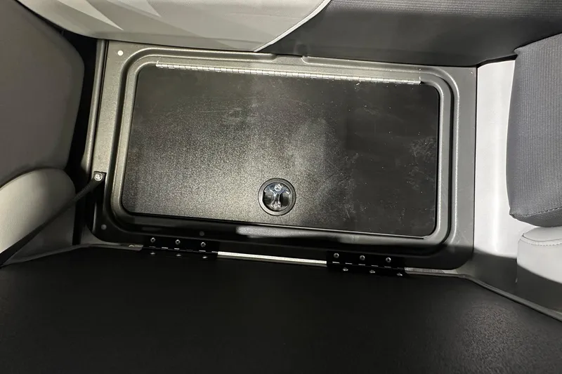 Slide: The Image of Storage compartment in 2026 Sun Tracker SportFish 22 DLX boat interior. - 24