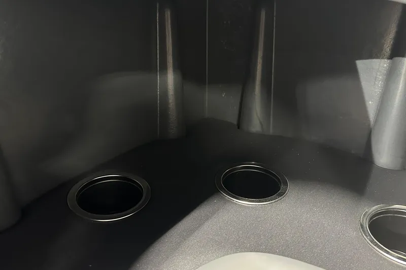 Slide: The Image of Interior view of 2026 Sun Tracker SportFish 22 DLX boat with cup holders. - 26