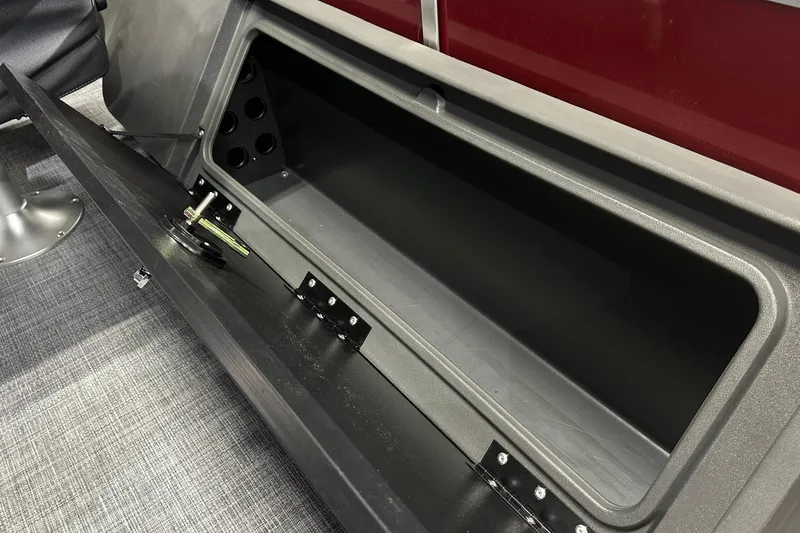 Slide: The Image of Open storage compartment on 2026 Sun Tracker SportFish 22 DLX boat. - 32