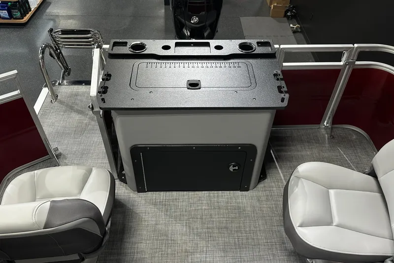 Slide: The Image of 2026 Sun Tracker SportFish 22 DLX interior with seating and storage. - 33