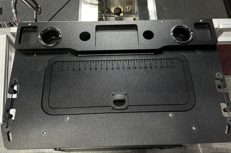 Slide: The Image of 2026 Sun Tracker SportFish 22 DLX fishing station with built-in ruler and cup holders. - 34