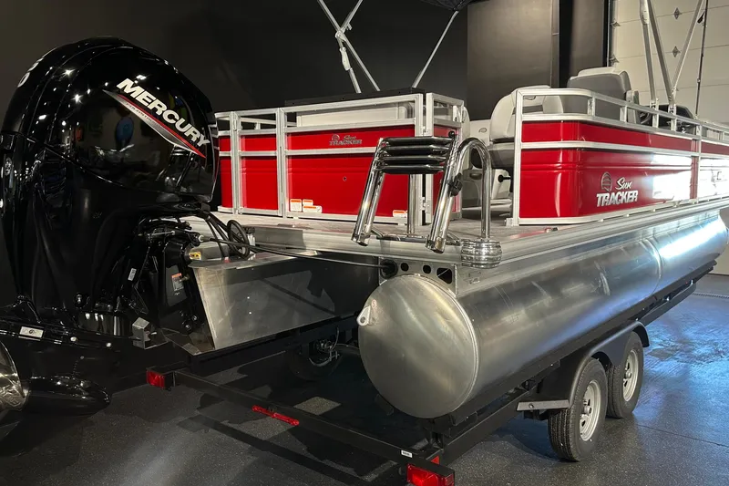 Slide: The Image of 2026 Sun Tracker SportFish 22 DLX pontoon boat with Mercury engine on trailer. - 6
