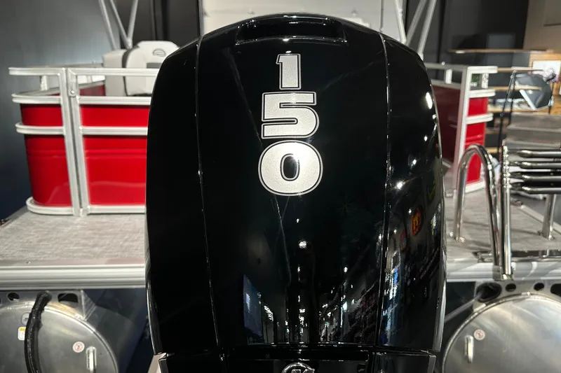 Slide: The Image of Outboard motor on 2026 Sun Tracker SportFish 22 DLX pontoon boat, red and silver design. - 9