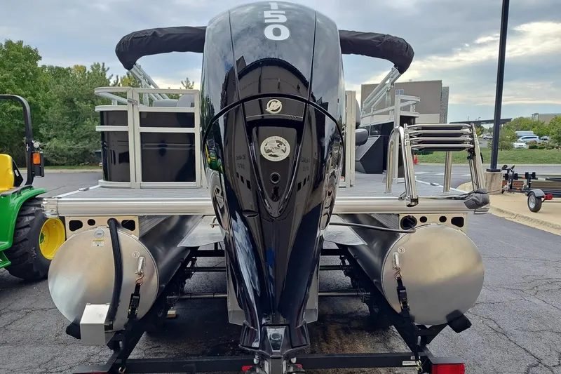 Slide: The Image of 2026 Sun Tracker SportFish 22 DLX pontoon boat with powerful outboard motor. - 3