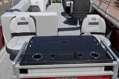 Slide: The Image of 2026 Sun Tracker SportFish 22 DLX interior with seating and table setup. - 4