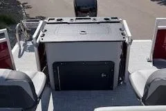 Slide: The Image of 2026 Sun Tracker SportFish 22 DLX boat interior with seating and storage. - 5