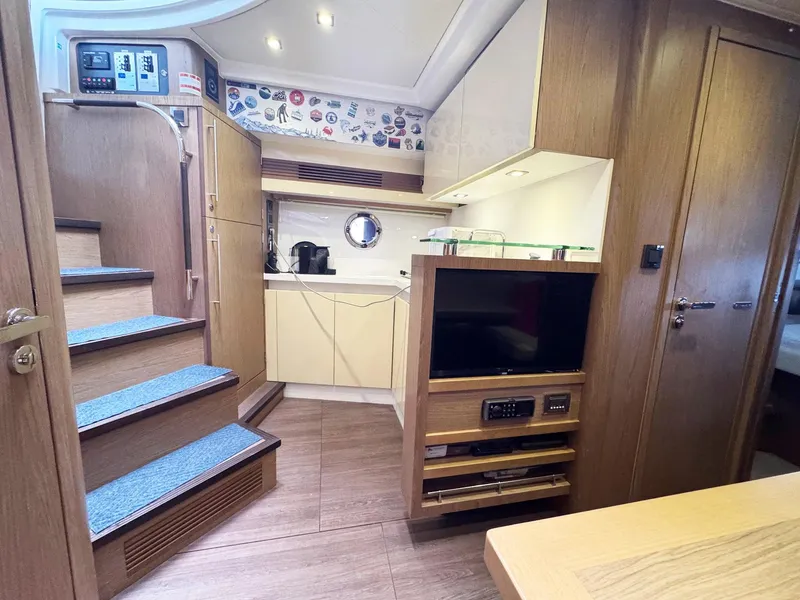 Slide: The Image of Interior of 2015 Beneteau Gran Turismo 44 yacht, featuring modern kitchen and entertainment area. - 3