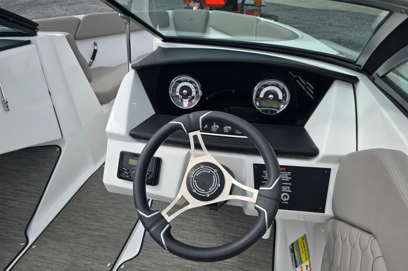 Slide: The Image of 2023 Four Winns H1 boat interior with gray seating and modern design. - 14