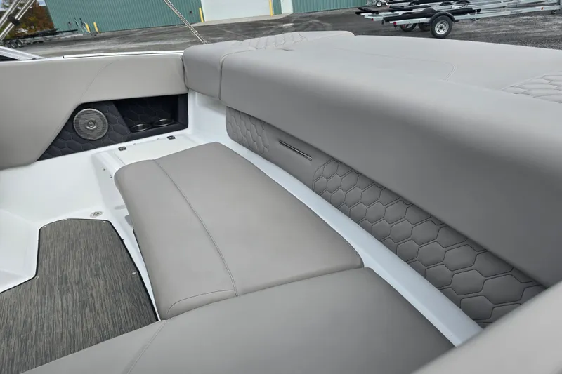 Slide: The Image of 2023 Four Winns H1 boat interior with modern dashboard and comfortable seating. - 21