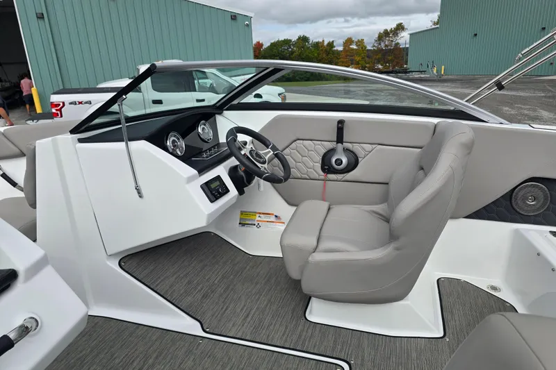 Slide: The Image of 2023 Four Winns H1 boat interior with sleek design and modern dashboard features. - 22