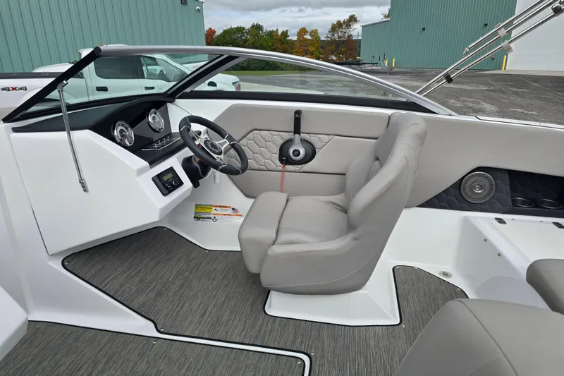 Slide: The Image of 2023 Four Winns H1 boat hull on trailer, close-up view. - 23