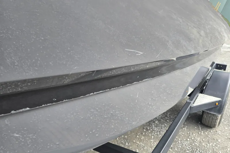 Slide: The Image of 2023 Four Winns H1 boat interior with gray seating and modern design. - 25