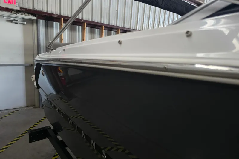 Slide: The Image of 2023 Four Winns H1 boat interior with modern dashboard and seating. - 29