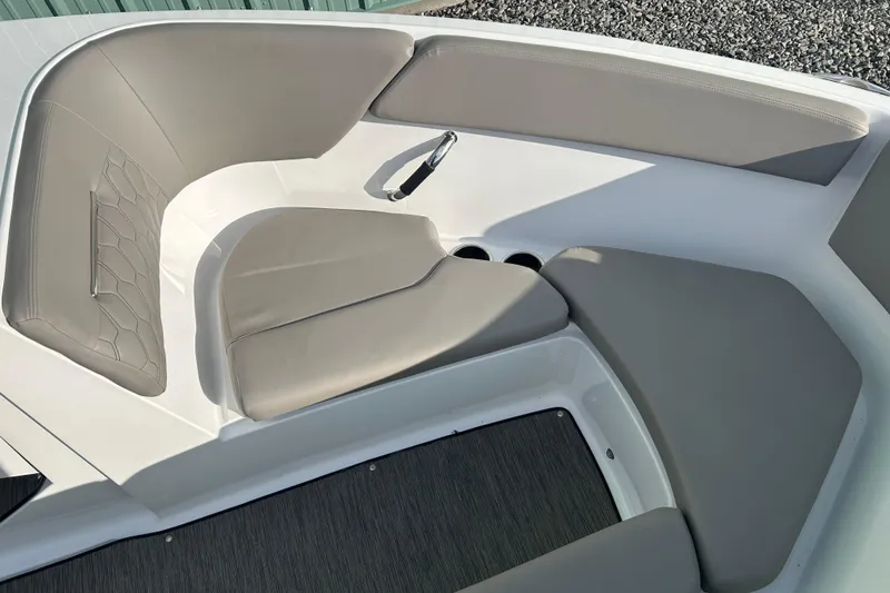 Slide: The Image of 2023 Four Winns H1 boat interior with gray cushioned seating and cup holders. - 34