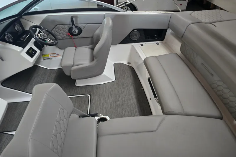 Slide: The Image of 2023 Four Winns H1 boat with sleek design and comfortable seating. - 8