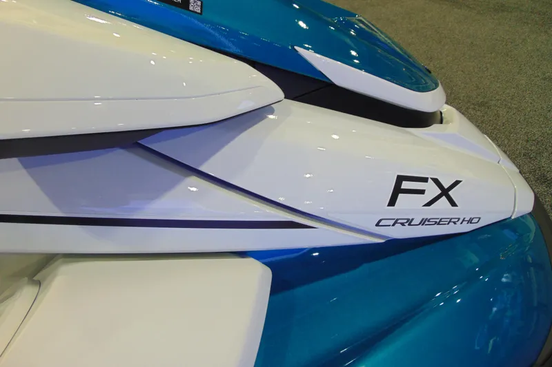 Slide: The Image of 2026 Yamaha WaveRunner FX Cruiser HO, sleek white and blue design, close-up view. - 9