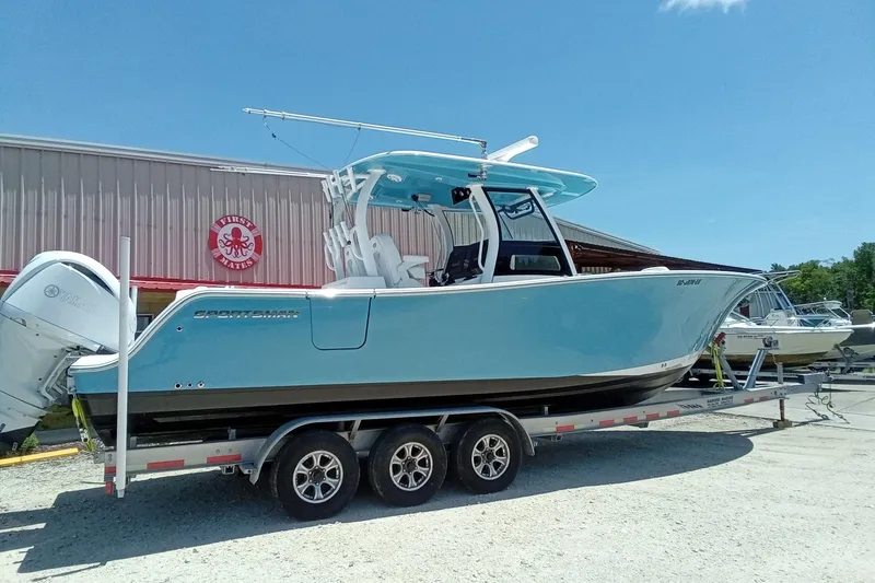Slide: The Image of 2022 Sportsman Open 302 Center Console boat on trailer, parked outdoors. - 10