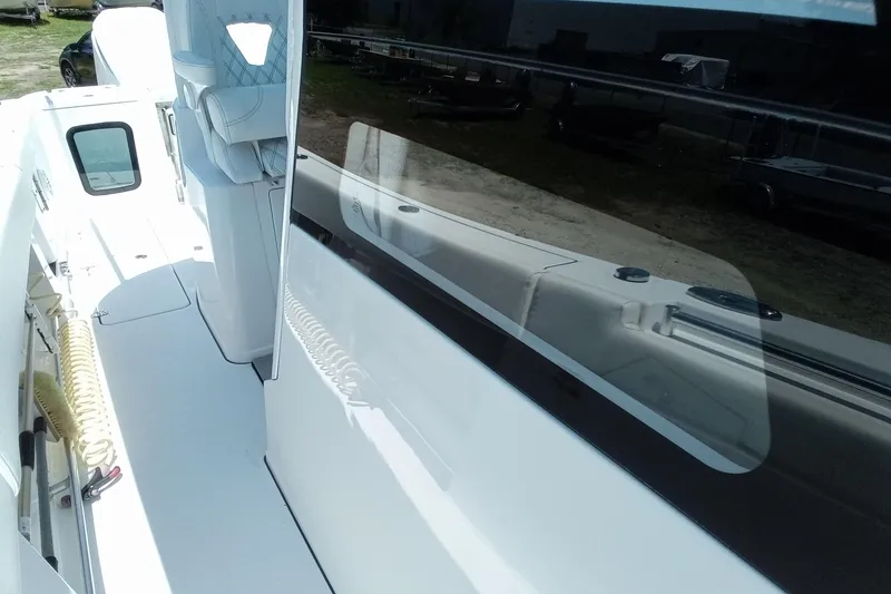 Slide: The Image of 2022 Sportsman Open 302 Center Console boat deck with seating and equipment. - 42