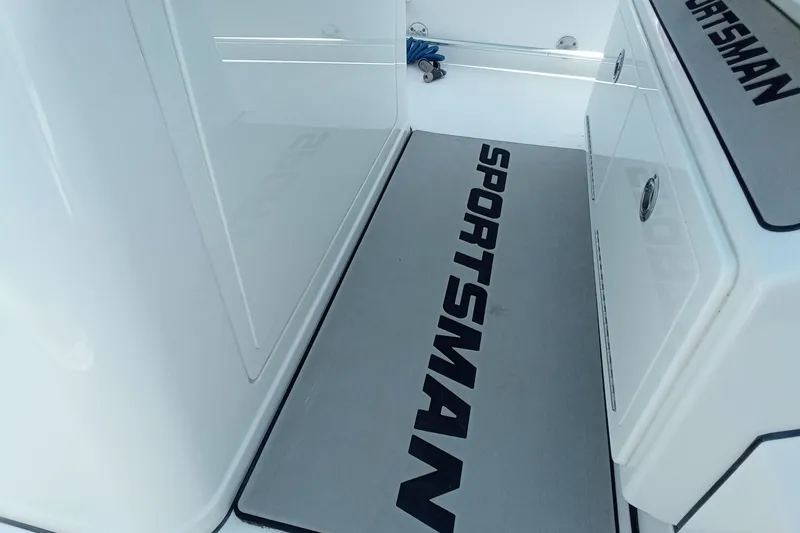 Slide: The Image of 2022 Sportsman Open 302 Center Console interior with branded flooring mat. - 43