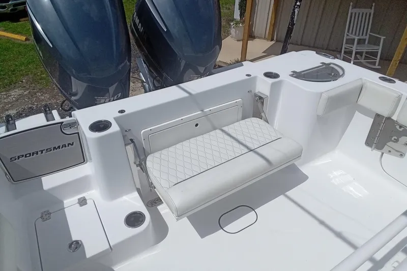 Slide: The Image of 2020 Sportsman Open 282TE Center Console boat with dual engines and seating area. - 15