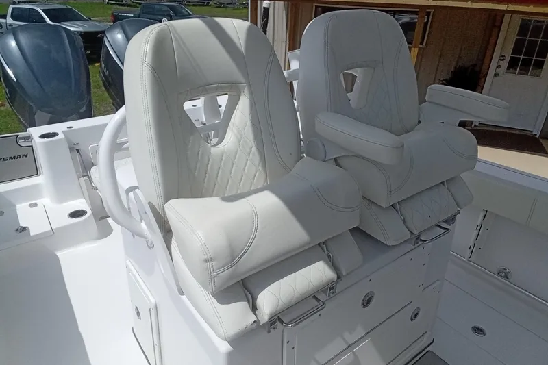 Slide: The Image of 2020 Sportsman Open 282TE Center Console with luxurious white seating and dual engines. - 17