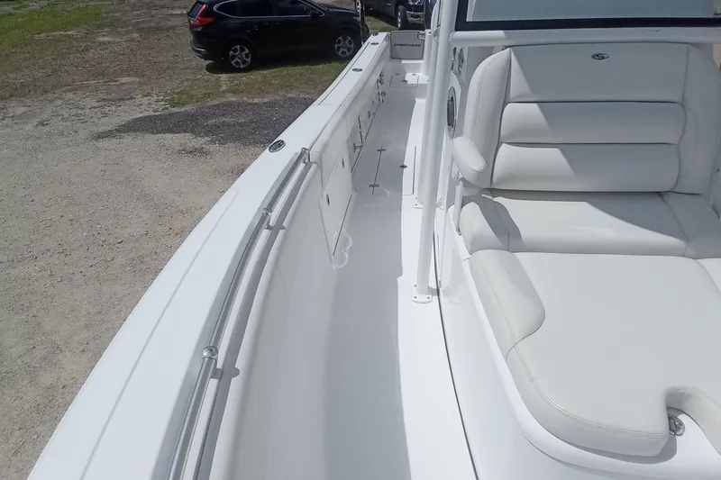 Slide: The Image of 2020 Sportsman Open 282TE Center Console boat with white seating and sleek design. - 27