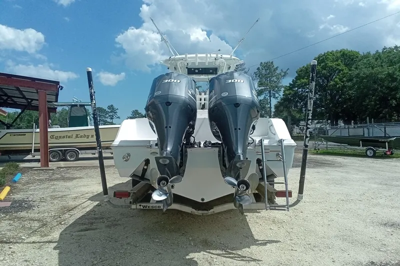 Slide: The Image of 2020 Sportsman Open 282TE Center Console with dual 300 horsepower engines, parked outdoors. - 4