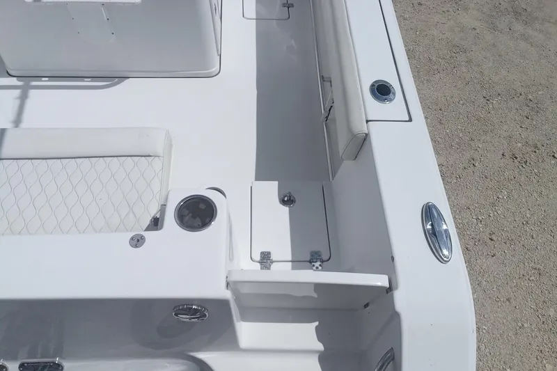 Slide: The Image of 2020 Sportsman Open 282TE Center Console boat interior, featuring seating and storage compartments. - 7