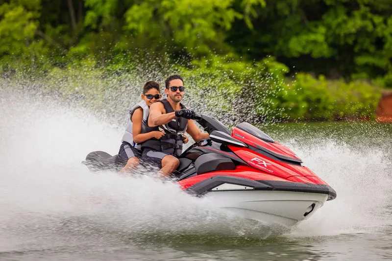 Slide: The Image of Manufacturer Provided Image: Father and son riding 2026 Yamaha WaveRunner FX Cruiser HO on a lake. - 2