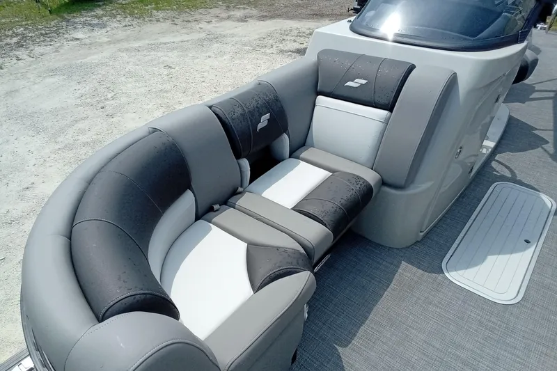 Slide: The Image of Luxurious seating on 2019 Starcraft MX 23 C boat, featuring sleek gray and black upholstery. - 5