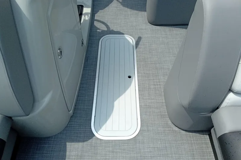 Slide: The Image of Interior of 2019 Starcraft MX 23 C boat showing floor storage compartment. - 7