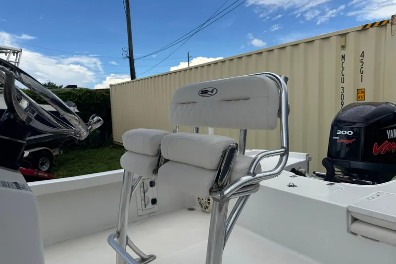 Slide: The Image of 2016 Sea Hunt BX 22 boat console with stainless steel frame, outdoor setting. - 6