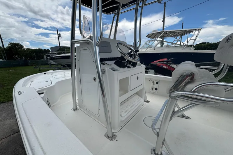 Slide: The Image of 2016 Sea Hunt BX 22 boat interior with cushioned seating and speaker. - 8