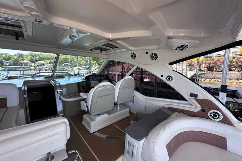 Slide: The Image of 2005 Sea Ray 48 Sundancer docked, rear view with "Vincitore" signage, Port of Liberty, MO. - 12