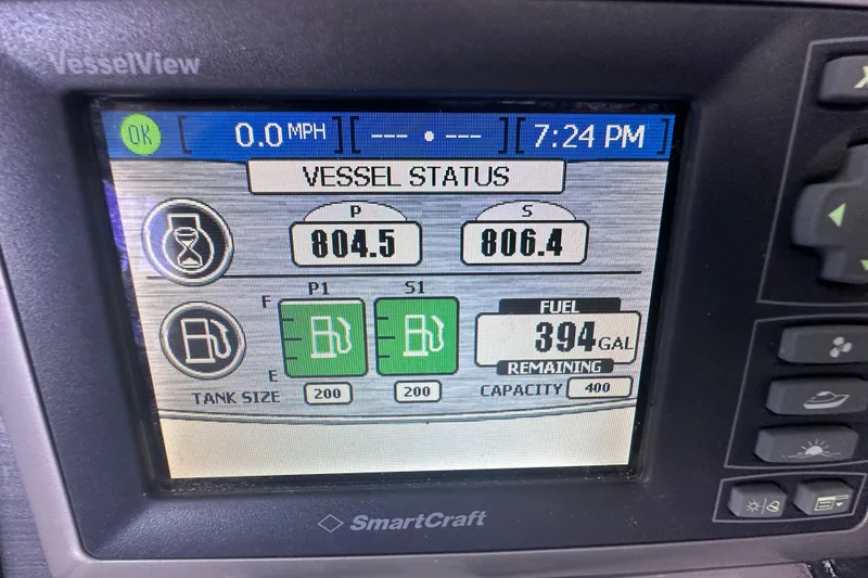 Slide: The Image of 2005 Sea Ray 48 Sundancer swim platform with teak-style decking at a marina. - 14